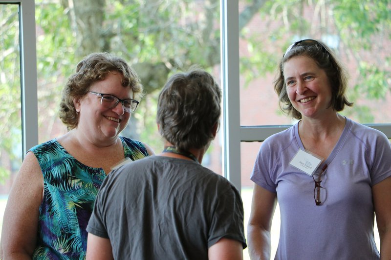 RTC teachers talking at a gathering