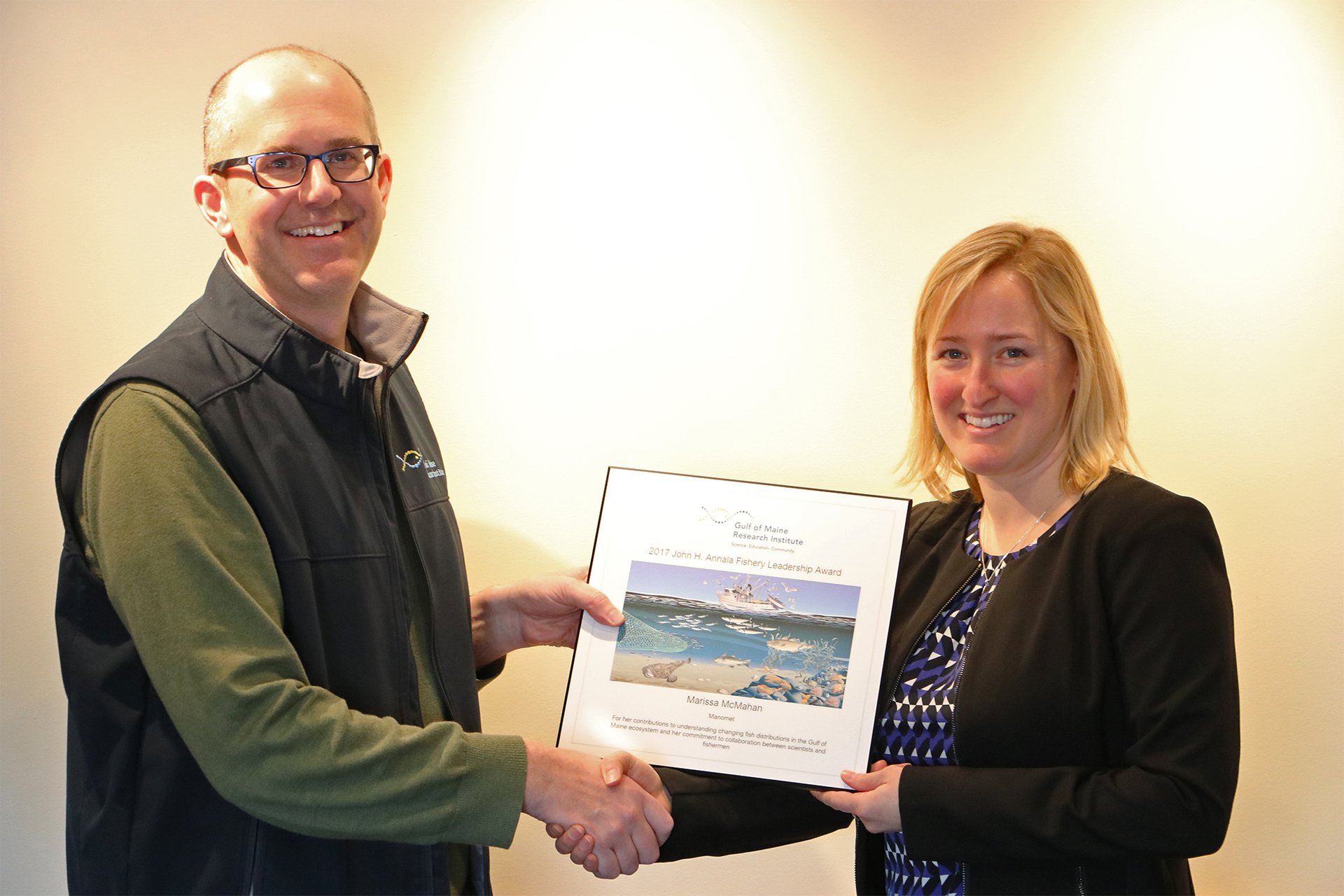 Andrew Pershing, our Chief Scientific Officer, shakes hands with Dr. Marissa McMahan as he gives her the Annala award certificate.