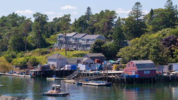 Mackerel Cove, full of docks, boats, lobster traps, and lots of shoreside infrastructure and housing.