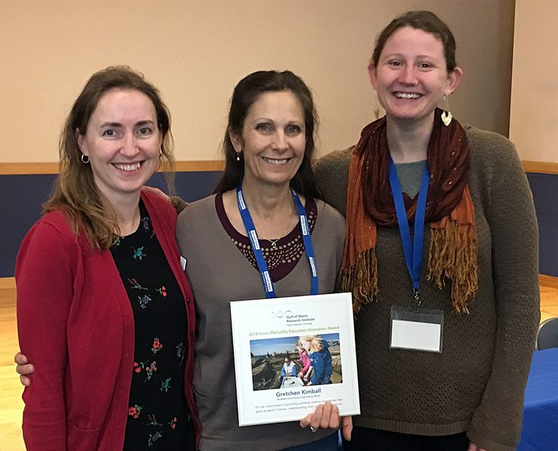 Gretchen Kimball stands with McCarthy Award and nominators