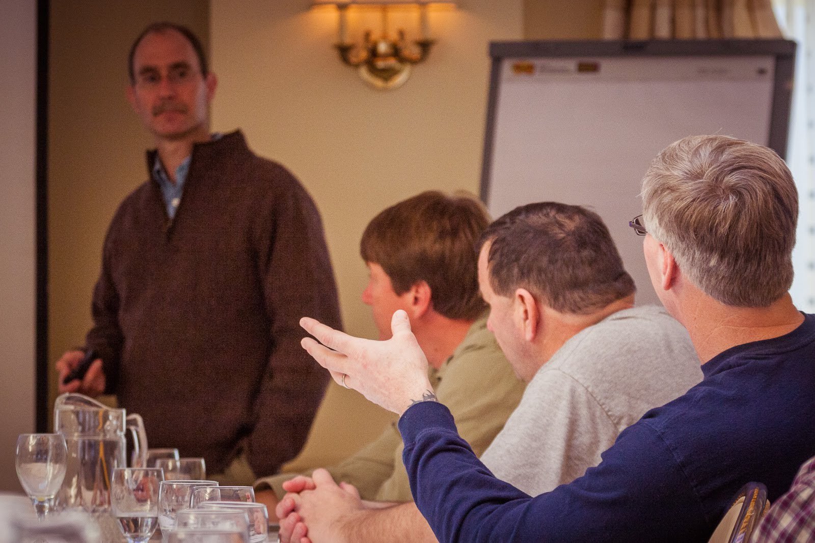 A group of fishermen, managers, and scientists gather in a MREP workshop.