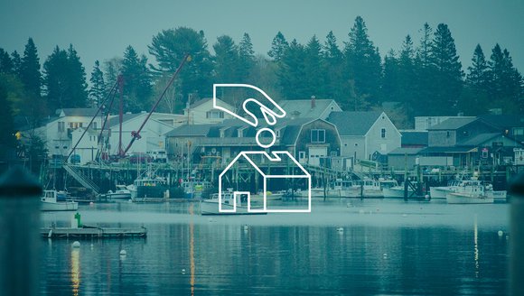 This is a white, line drawn graphic of a hand dropping a ball into the outline of a building, layered on top of a faded blue image of a working waterfront.