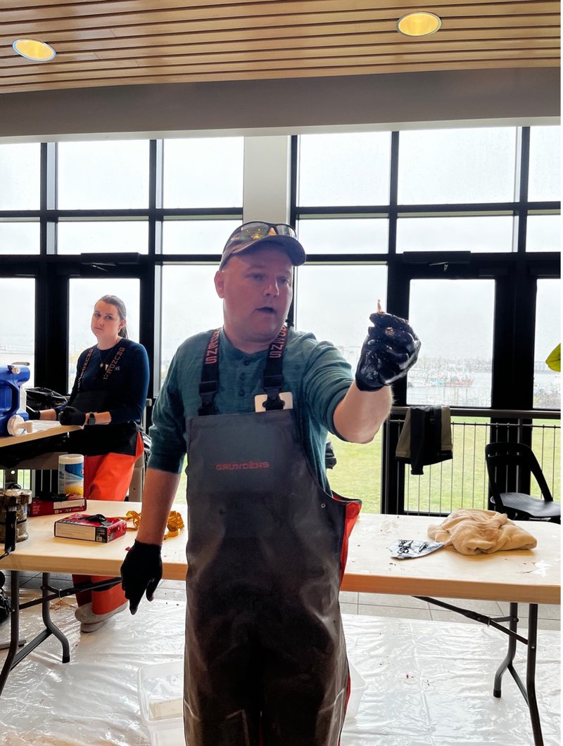 Dr. Walt Golet holds a tuna otolith during Tuna School.